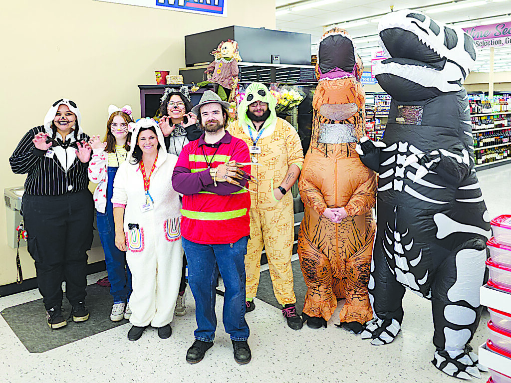 PRICE MART The crew at Price Mart show their Halloween spirit by coming to work in costumes.