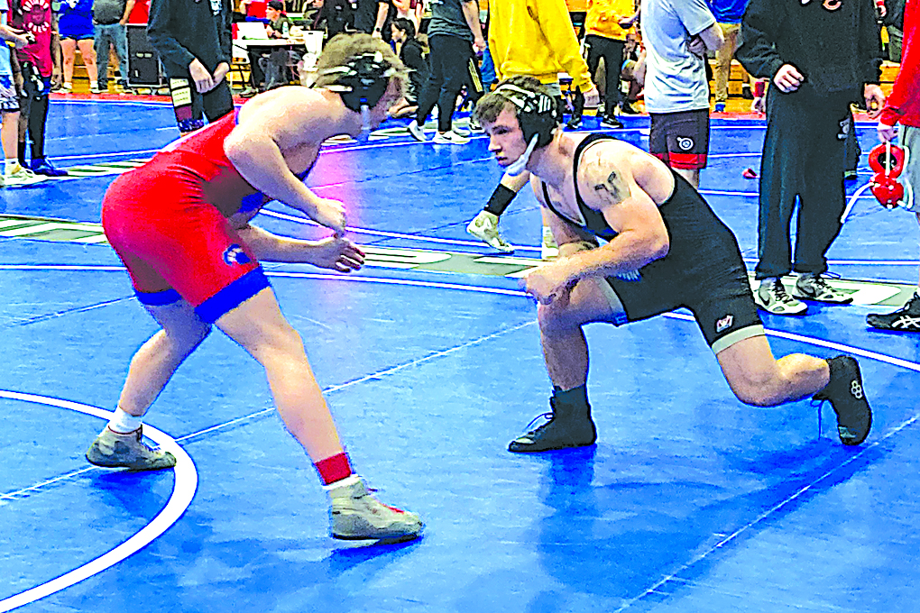 SAPULPA’S ALEXANDER HENDERSON (right) takes on Bixby’s Rhys Novosad in the 157-pound quarterfinals on Saturday at the Bixby Open. Henderson won the match in a gritty 2-1 decision on his way to placing second
