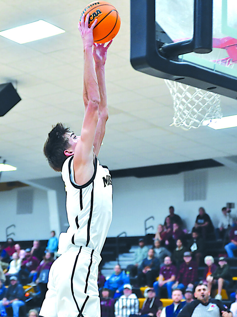 CHARISSA COOPER PHOTO MOUNDS JUNIOR AUSTIN JONES, shown here dunking against Kellyville last week, led the Golden Eagles in scoring Friday night against Stroud with 16 points.