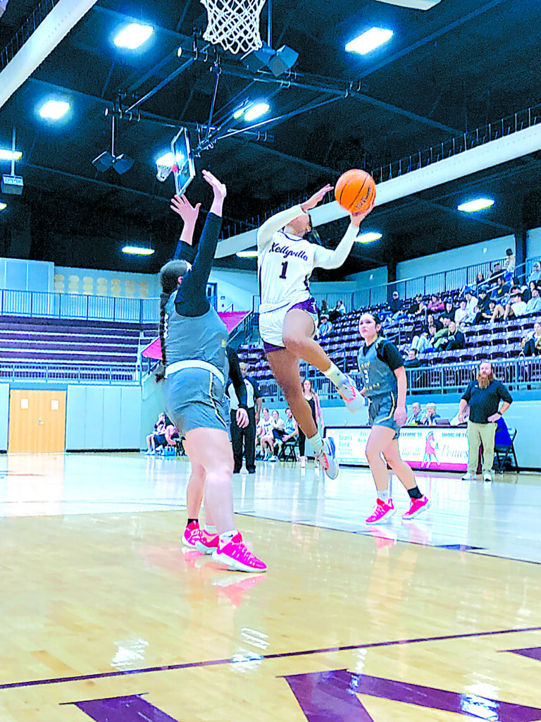 SENIOR ANTONIA MCGUIRE gets airborne as she goes up for a layup, part of her 19 points Tuesday night