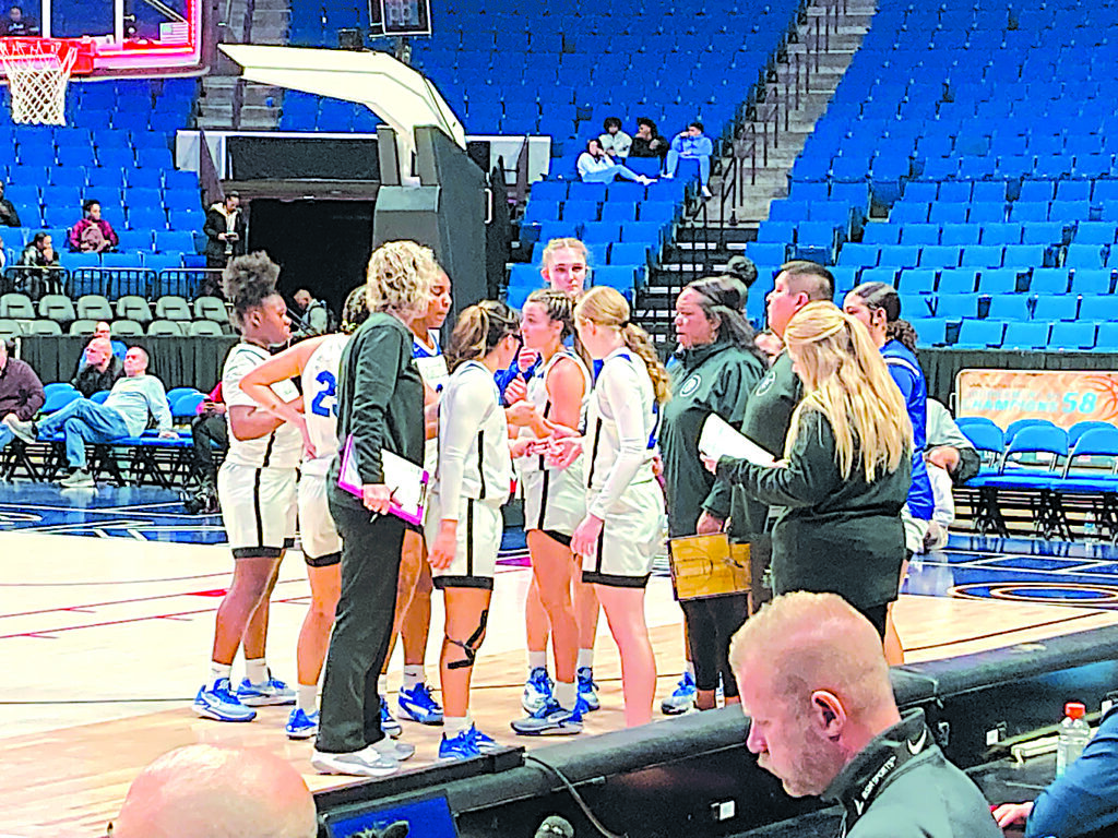 JOHN TRANCHINA PHOTOS SAPULPA LADY CHIEFTAINS confer with coach Darlean Calip during a timeout in their game against Lincoln Christian Thursday in the semifinals of the 58th Annual Tournament of Champions at the BOK Center in downtown Tulsa.