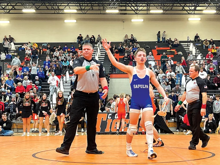 JOHN TRANCHINA PHOTOS
ETHAN PETERSON, getting his arms raised after his East Regional championship at 138
pounds, placed fourth at the 5A state tournament on Saturday.