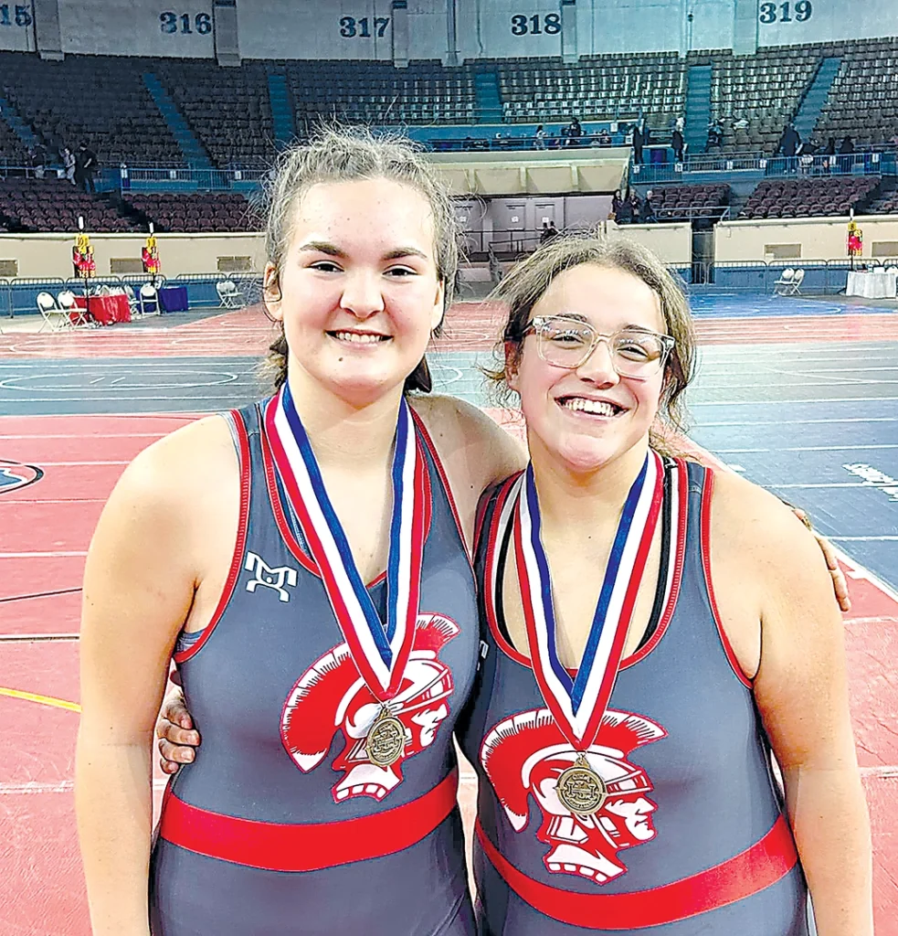 SUBMITTED PHOTOS FRESHMEN LIBBEE PENDERGRAFT (LEFT) AND CYNTHYA LOVE, shown here wearing their medals after placing fifth and third, respectively, at the Junior High state tournament on Feb. 1, both qualified for the Class 5A high school state tournament.