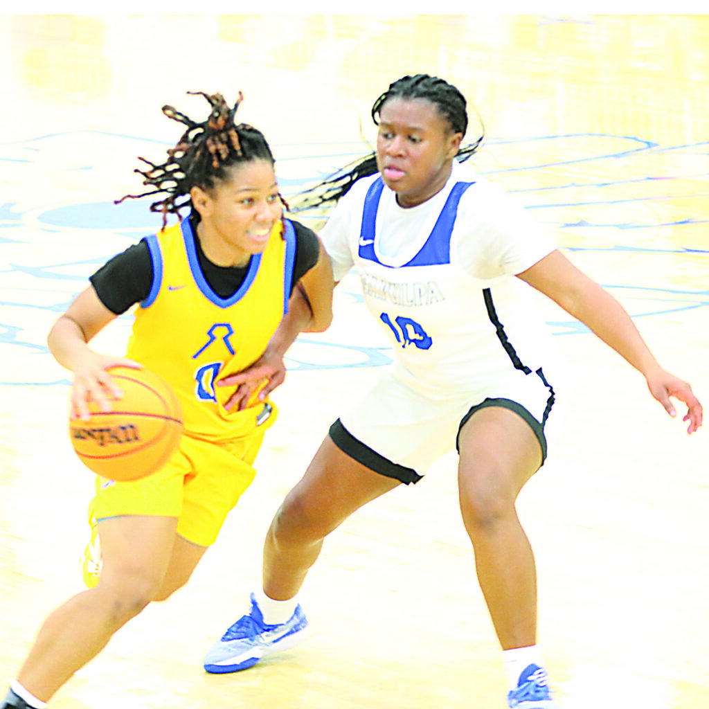 DARREN SUMNER PHOTO RIKI MCQUARTERS played tough defense against Rogers Friday night, while also scoring nine points. Her two key free throws with seven seconds left tied the game at 46-46.