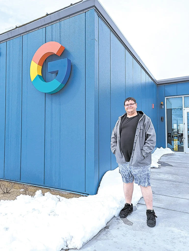 Google Data Center Technician and Central Tech grad PETER SANSING poses for a photo outside of the Google Data Center in Pryor, Oklahoma. Sansing credits his training at Central Tech for helping him land his dream job at Google.