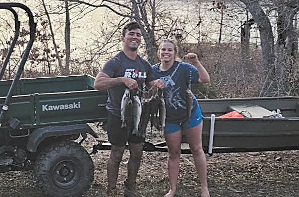 Norma Travelletti’s son Ryan, and his girlfriend, Kayli Barrett, proudly display a trigger full of prized trout they caught Sunday at Pretty Water.