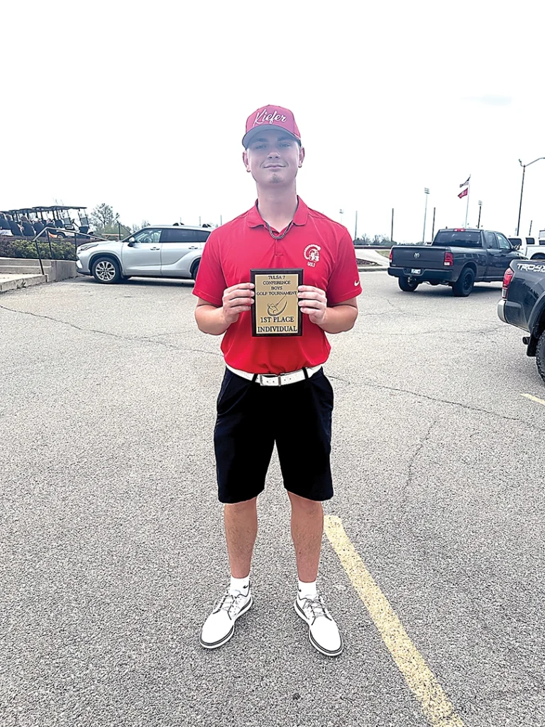 SUBMITTED PHOTO KIEFER SENIOR DILLON MACKEY proudly holds up his Individual Champion plaque from the Tulsa 7 Conference tournament on Monday.