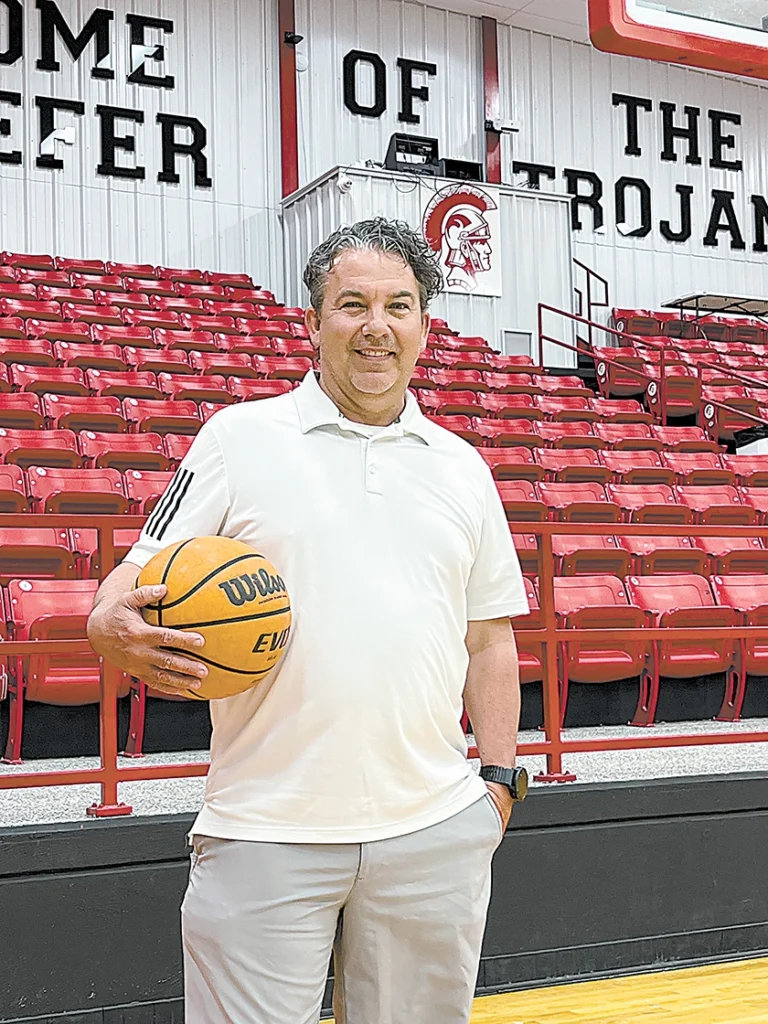DARREN SUMNER PHOTO MIKE HUGHES was introduced as the Lady Trojans’ new head basketball coach on Wednesday at the Caitlyn Mathis Event Center.