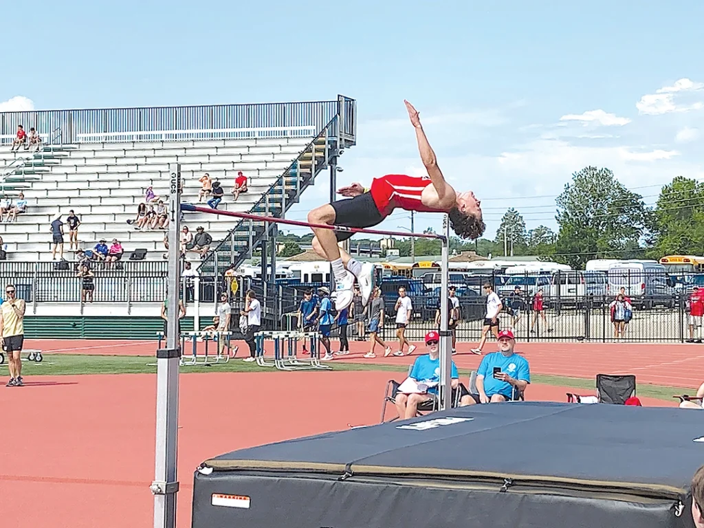 JOHN TRANCHINA PHOTOS KIEFER’S TY BURNETT won the Class 3A state championship in the high jump Saturday, matching the state record with this leap over the bar at 6-feet-10.