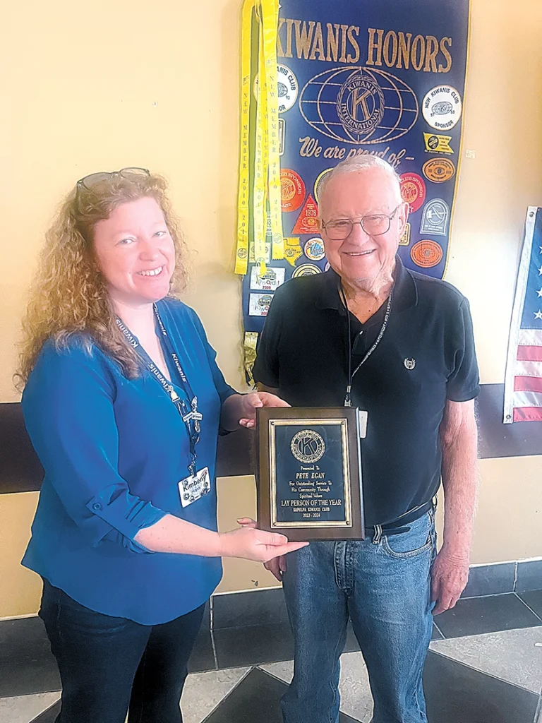 SUBMITTED PHOTO KIMBERLY HAYES (left), Chair of the Human and Spiritual Values Committee and President- Elect, presents award to Pete Egan (right).