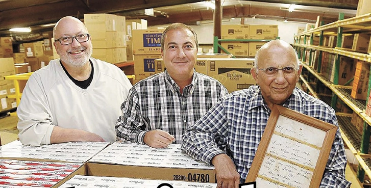 SAM, JIMMY AND JERRY NAIFEH celebrate their company’s 100th Anniversary in 2014 at Standard Distributing.