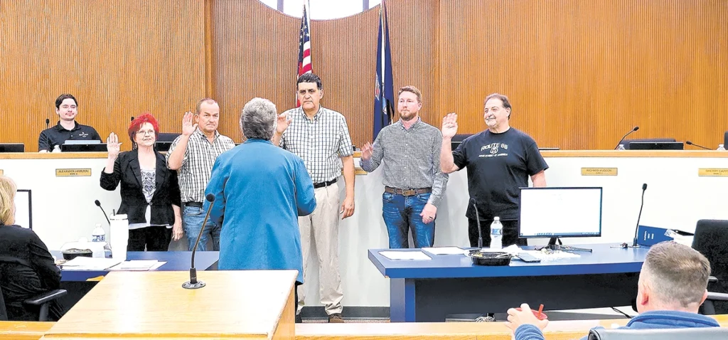 CHARLES BETZLER PHOTOS MEMBERS SWORN IN: (Left to Right) Sherry Capps, Marty Cummins, Jeff Molina, Richard Hudson and Hugo Naifeh sworn in Monday evening.