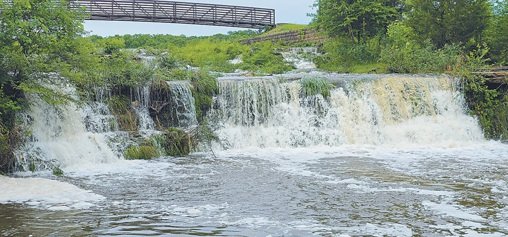 CHARLES BETZLER PHOTOS THE FALLS AT PRETTY WATER LAKE gushing with water following the storm that dumped a lot of rain on the area Tuesday night.