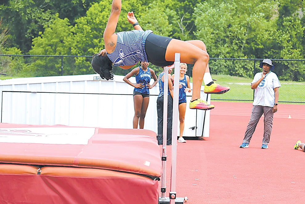 DARREN SUMNER PHOTOS TYLA HEARD cleared 5-foot-2 to claim second place in the high jump Saturday at Jenks and qualified for the 5A state meet.