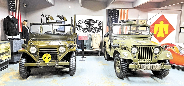 WORLD WAR II-ERA JEEP with the Thunderbird insignia behind it representing the 45th
Infantry Division of the Army National Guard.