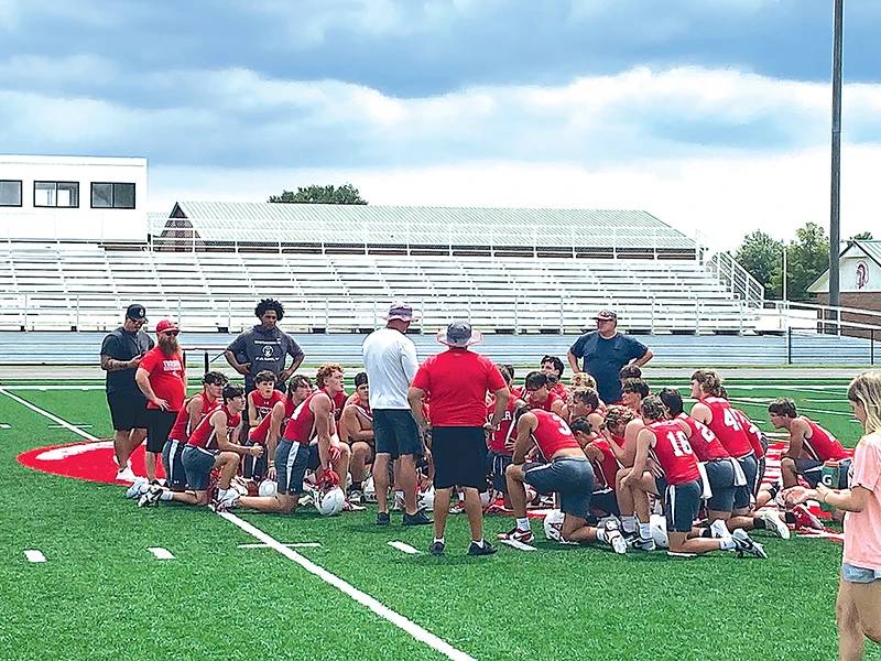 JOHN TRANCHINA PHOTOS KIEFER TROJANS were back on the field Monday, gathering around Coach Trent Worley (center, with white shirt) after their 7on7 session with Berryhill was over.