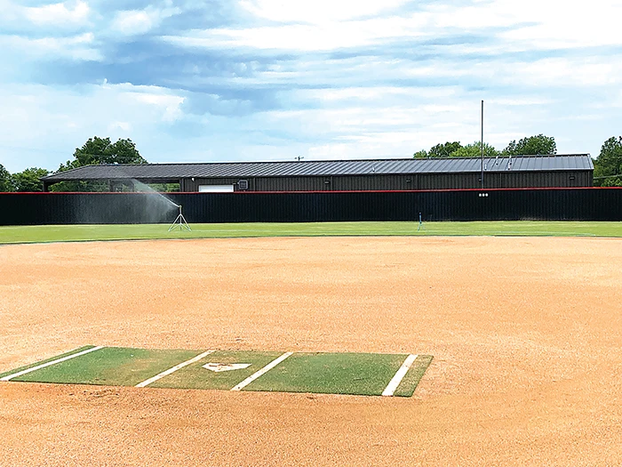 JOHN TRANCHINA PHOTO KIEFER’s softball field was empty, with the sprinkler going, on Thursday. The Lady Trojans start official 2024 season practice on July 22.
