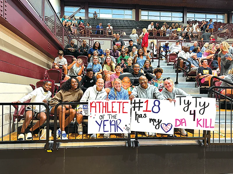 TYLA HEARD’S CHEERING SECTION at Jenks Tuesday night, consisting of family, friends, former Sapulpa teammates and her new basketball teammates at Oral Roberts University (in the front row)