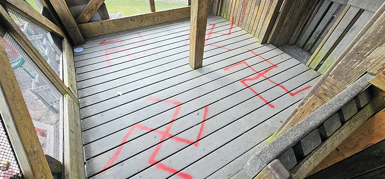 CHARLES BETZLER PHOTOS Top floor of the tower at Heritage Park with swastikas spray painted on the floor.