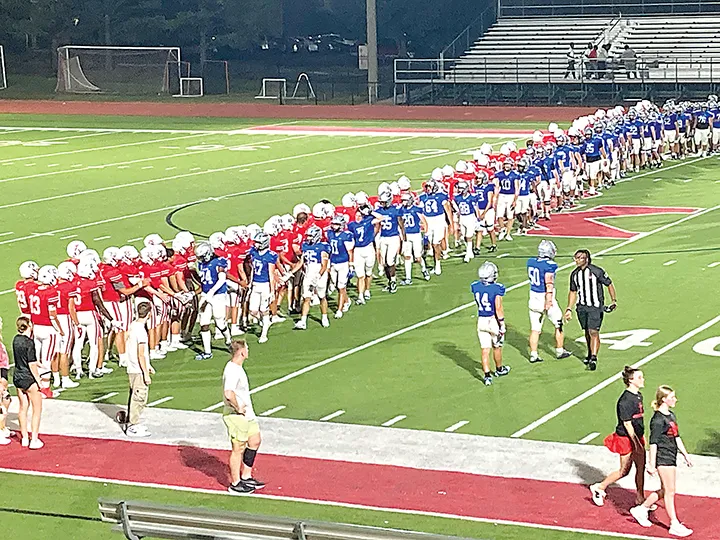 JOHN TRANCHINA PHOTOS
GOOD GAME Sapulpa and Bishop Kelley line up to shake hands after their 14-14 tie Thursday
night in the final preseason scrimmage. The Chieftains open the regular season next Friday
night at Tahlequah.