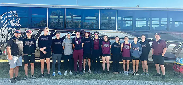 KELLYVILLE CROSS COUNTRY saw their boys qualify as a team for the first time, along with
one individual girl (Eithne Wiehl). The full team is above, with Athletic Director Kevin Nance (far
left) and coach Alex Bryan (far right).