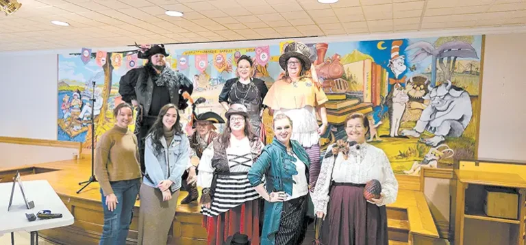 LIBRARY STAFF and volunteers pose in their Cosplay costumes. Bottom row, from left to right:
Library Aide Hannah Makela, Library Aide Regan Wright, Genealogy Librarian Rhonda Huffman,
Assistant Library Director Melodie Reader-Jones, Youth Librarian Lilly McCully and Executive
Director of Creek County Literacy and former Assistant Library Director Debra Chandler. Top
row, from left to right: Librarian Ray Bevenue, volunteer Tabitha Able and Library Director Kristin
Haddock.