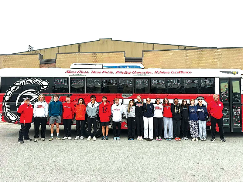 SUBMITTED PHOTOS READY TO RUN! Kiefer’s full cross country team in front of the bus before leaving for state on Saturday morning.