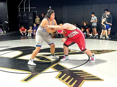 WILLIAM KELLEY (left) pinned Union’s Evan Gorden in exactly one minute in this match, and
went on to place fourth at 285 pounds in the Junior High competition on Saturday.