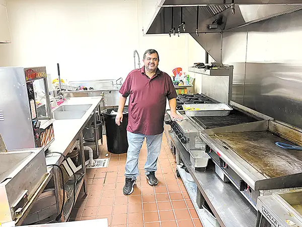 DARREN SUMNER PHOTO
DAVOOD MORTAZAVI cleans up the kitchen at the Elks Club after cooking breakfast.