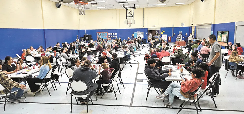 PARENTS and students play bingo at The Liberty Elementary Books and Bingo Night.