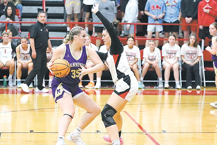 SENIOR HALEY GOODMAN plays tough man-to-man defense against the Mannford Lady Pirates at home on Tuesday night.