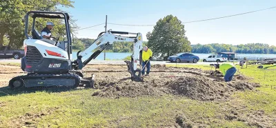 CONSTRUCTION FINALLY UNDERWAY David Garcia, Jesus Palacias and Rogela Luerens, employees of Rojo Red Concrete, begin excavation for the concrete slab of the new bathroom and showers at Lake Sahoma.