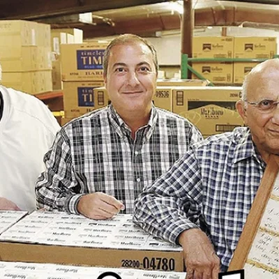 SAM, JIMMY AND JERRY NAIFEH celebrate their company’s 100th Anniversary in 2014 at Standard Distributing.